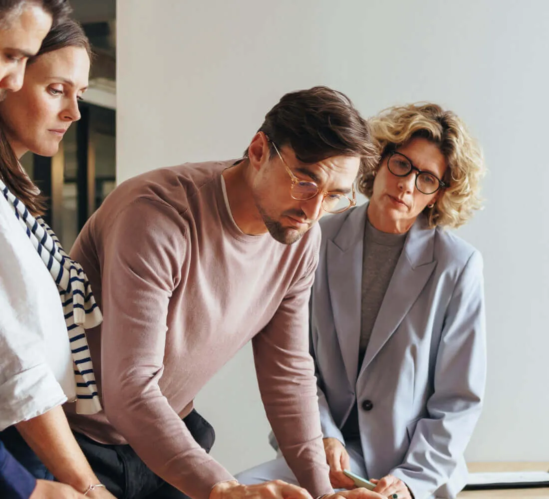 Group of people looking at some papers